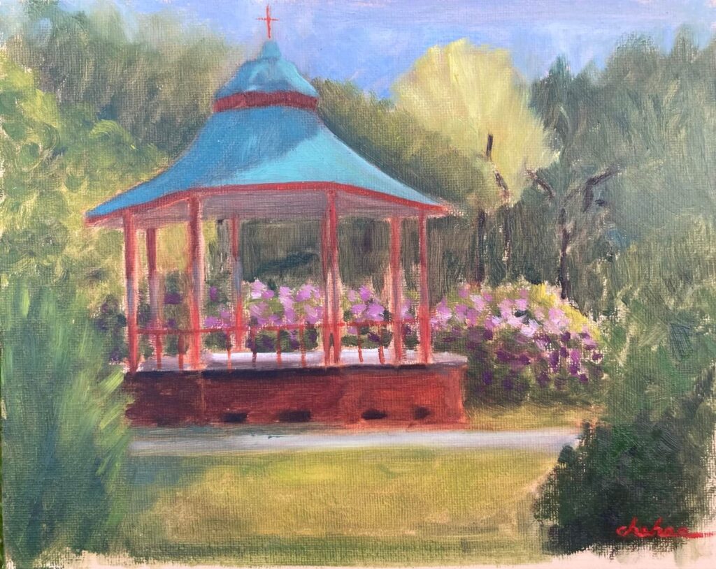Plein air oil painting of the Victorian bandstand in Sefton Park Liverpool surrounded by spring flowers and lush green trees