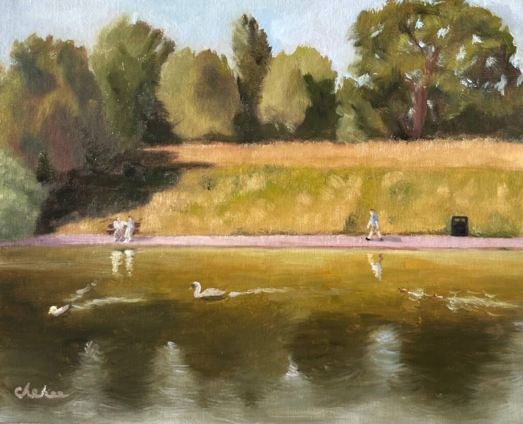 Plein air oil painting of Sefton Park pond with a swan and ducks swimming, two people seated on a bench, and a person walking along the path in warm sunlight