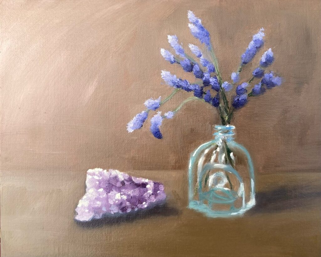 Oil painting of purple lavender sprigs in a small glass bottle beside a rough amethyst crystal, on a warm brown background