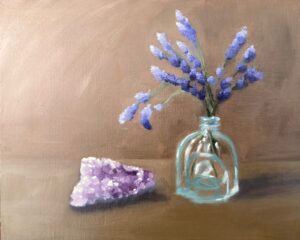 Oil painting of purple lavender sprigs in a small glass bottle beside a rough amethyst crystal, on a warm brown background