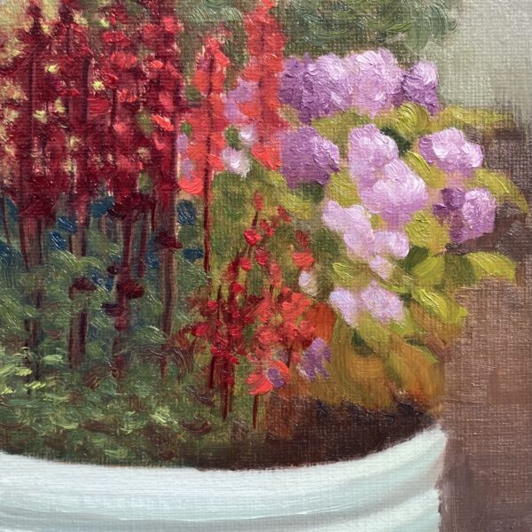 Oil painting of a white planter filled with crimson salvia and lilac hydrangea against a green hedge background.