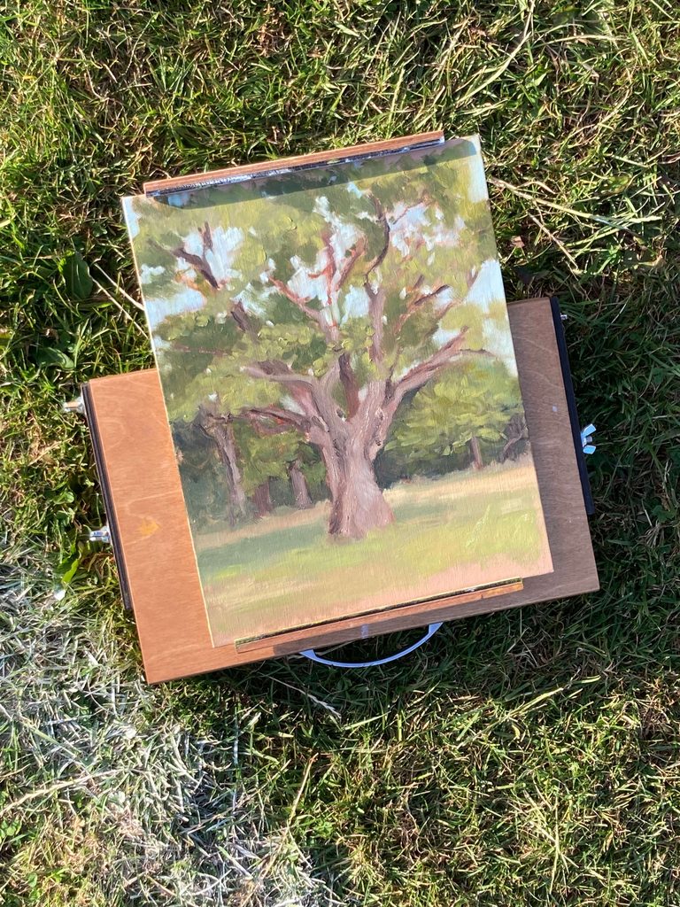 Pochade box with reversed lid holding a wet painting securely